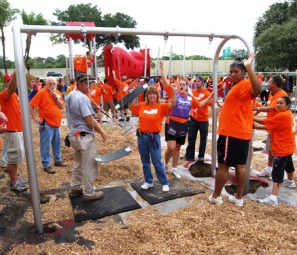Volunteers build a playground at Community Charter School of Excellence in Tampa.