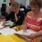 Joanne Land, right, sorts vocabulary words into tiers to learn more about how Common Core standards work. Land was one of hundreds of parents who attended a recent Parent University session. Many parents said they wanted to learn more about Common Core standards and testing.
