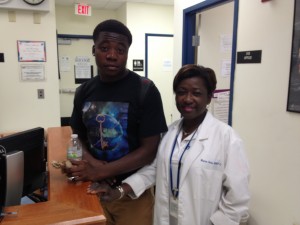 Nicholas Boothe (left) had an asthma attack last winter and Dr. Marcia Dodo (right) helped stabilize him at the North Miami Beach Senior High clinic.