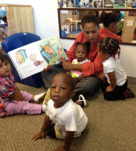 Every morning, children at Education Station begin the day with a hug and a book.