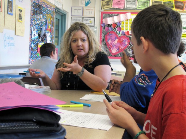 Monroe Middle School teacher Dawn Norris talks to her students about how to write an essay about fairy tales. Norris has been teaching based on the Common Core standards for two years. Since making the switch, she says her students have taken more control of the lessons.