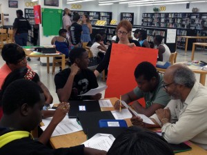 Sara Weinberg talks Miami Northwestern High School students through an Algebra Project assignment.