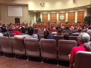 Testing opponents quietly show support for speakers at Tuesday's Lee County school board meeting. The board voted 3-2 to reverse its state testing boycott.