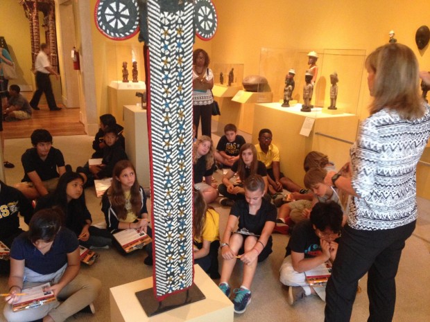 St. Petersburg Museium of Fine Arts docent Tina Douglass shares the story behind an African elephant mask with sixth graders from Clearwater's Oak Grove Middle School.