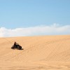 beaver_dunes_crop A man rides an ATV across the sand at Beaver Dunes, a former state park recently aquired by the City of Beaver.
