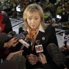 Oklahoma Gov. Mary Fallin speaks to the media before the memorial to OSU women's basketball Head Coach Kurt Budke and assistant coach Miranda Serna. Caption