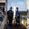 Natural gas engineers Engineers at work on a drilling platform of a shale fracking operation.