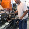 Inmate running a lathe