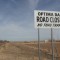 About three miles past this sign is the recently closed road across the three-mile long Optima Dam. The road was closed after money to make repairs to guardrails could not be found.
