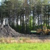 A pile of coal sits along the railroad tracks just east of Red Oak, Okla.