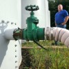 WASTE REMOVAL OPERATOR IN OHIO Roger Root stands next to an wastewater holding tank near an injection well on his Newton, Ohio farm. Ohio passed tough