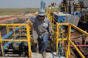 Toolpusher and rig manager Darrin Silcot walks the perimeter of a Triad Energy horizontal drilling operation near Alva, Okla.
