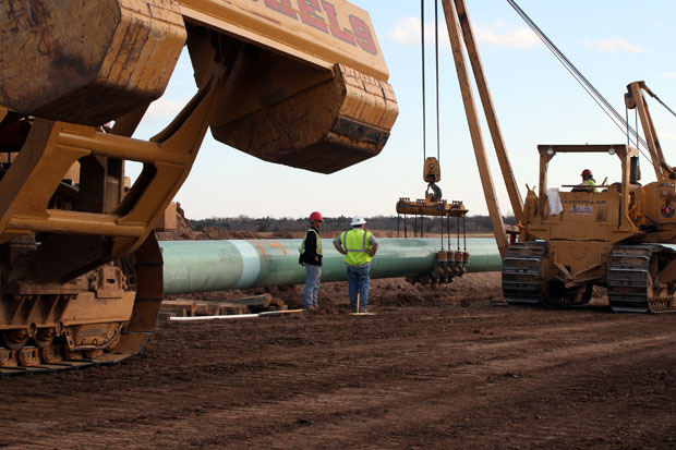Construction started on the Keystone Gulf extension in 2012. Here, contractors bury as section of the pipe near Stroud, Okla.