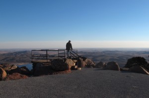 Meers area resident Bill Cunningham looks for haze over the Wichita Mountains from the top of Mt. Scott.