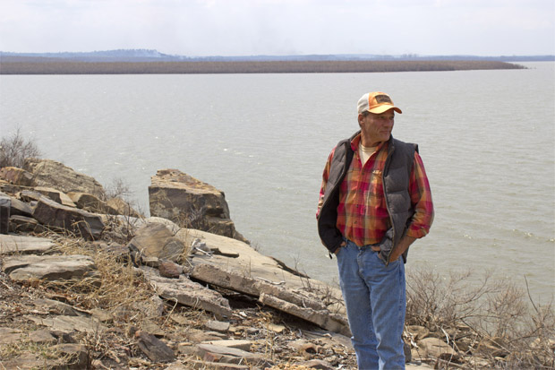 Rick Geisler, manager of Wah-Sha-She Park in Osage County, stands on the shore of Hula Lake.
