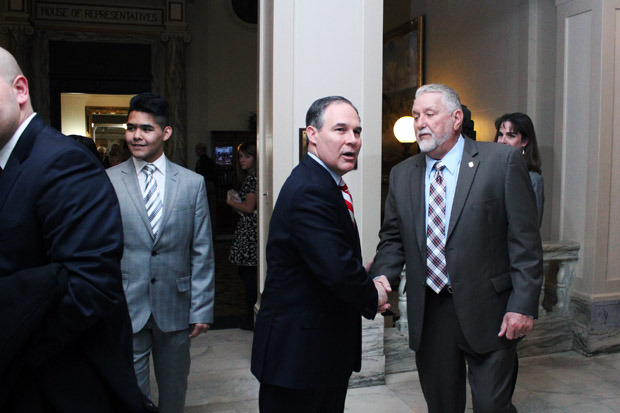Oklahoma Attorney General Scott Pruitt shakes hands at the state capitol after the annual State of the State address.
