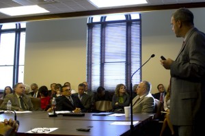 Austin Holland with the Oklahoma Geological Survey, seated in the center, at a capitol hearing on Oklahoma's earthquake surge.