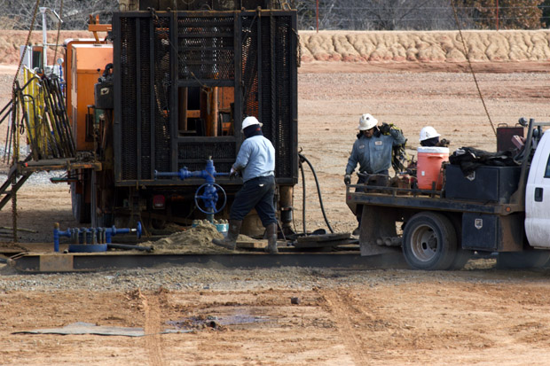Workers with Shebester-Bechtel at an American Energy Woodford rig site in Payne County, Okla.