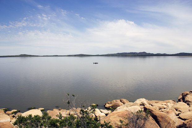 Boats meet in the middle of Tom Steed lake in southwestern Oklahoma in May 2014. Under normal lake conditions, the rocks in the foreground would be submerged.