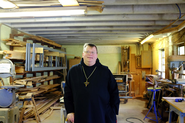 Lawrence Stasyszen, abbott of St. Gregory's Abbey, stands inside the monastery's condemned workshop in Shawnee, Okla. The monastery and associated college are still reeling from millions in damage from a 5.7-magnitude quake that struck in 2011.