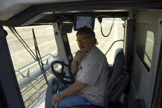 Craig Wolf, a custom cutter from South Dakota, travels to Oklahoma every year to harvest the Schmedt family's wheat.