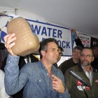 Actor Mark Ruffalo holds up a jug of water drawn from a well in Dimock, Pa. Ruffalo spoke at a rally this week after helping deliver fresh water to affected residents.