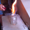 A Leroy Township, Bradford County resident lights a sample of methane gas on fire. The gas has been bubbling into puddles and creeks for more than two months.