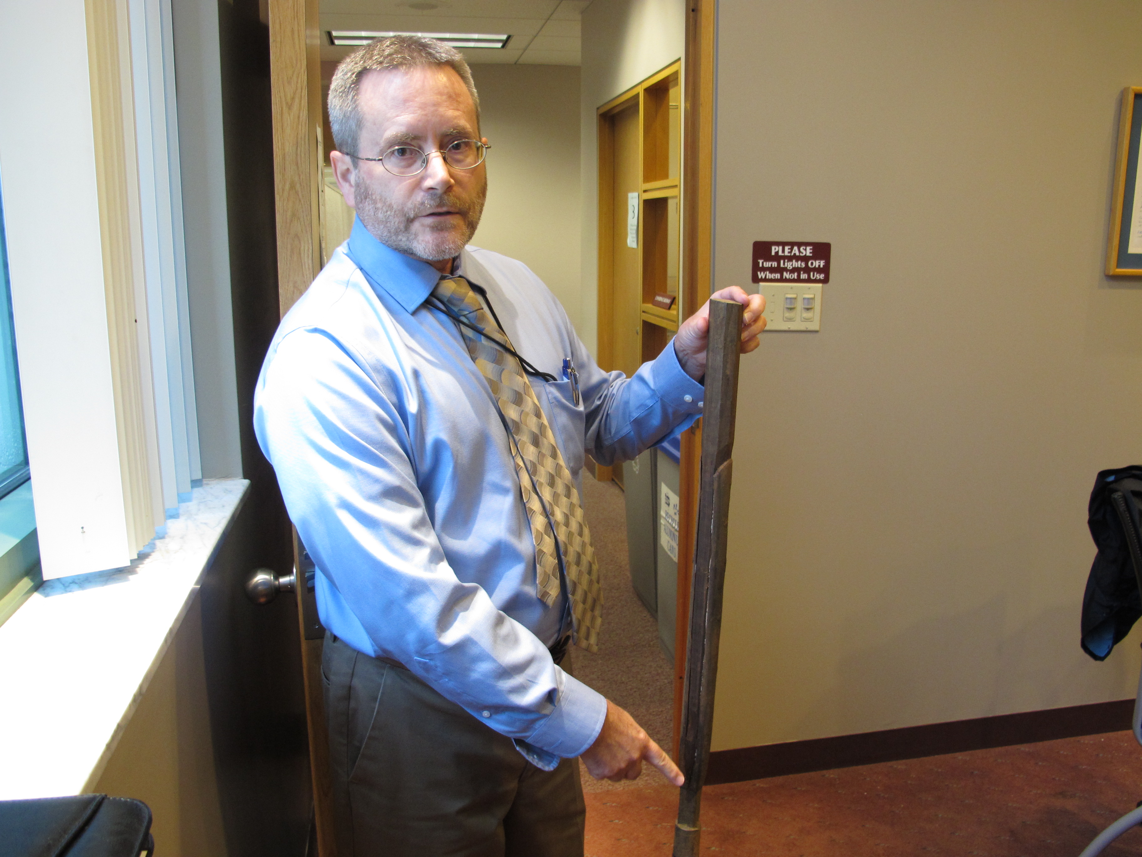 Gene Pine, who heads the Department of Environmental Protection's abandoned wells unit, shows off a 'sucker rod' found inside a well drilled in the 1870s