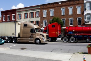 Trucks drive down Towanda's main drag. Click on the image to view StateImpact Pennsylvania's new multimedia project, called "Boomtown."