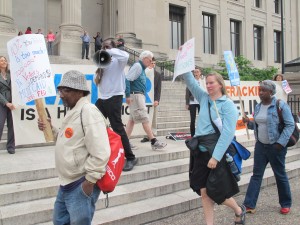 Activists marched outside the Franklin Institute protesting education cuts, welfare cuts, and natural gas drilling.