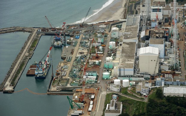Photo taken from a Kyodo News helicopter over the town of Okuma, Fukushima Prefecture, shows the Fukushima Daiichi Nuclear Power Station on July 9, 2013. Tokyo Electric Power Co., the operator of the crippled plant, said the same day that the density of radioactive cesium in groundwater by the sea at the plant has soared to around 90 times higher than three days ago. 