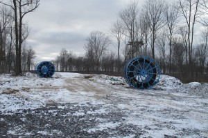 Large spools of tubing sit in an area cleared of trees in the Tiadaghton State Forest.
