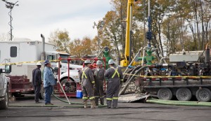 Workers vaccuum any water or fluids surrounding a frack site in Harford Township, Pa.  
