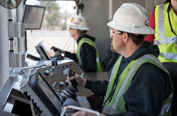 Test technicians Charles Young and Ethan Eckard use joysticks and touch screens to operate Schramm's T500XD drilling rig. 