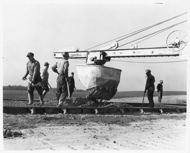 Workers spread concrete by hand in Somerset, Pa. during construction of the Pennsylvania Turnpike in 1939. 