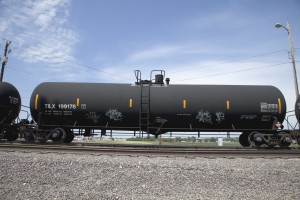 A DOT-111 rail tanker travels through Council Bluffs, Iowa. The expanded use of these older freight-rail cars by the oil industry has prompted calls for safety upgrades. Philadelphia is one of busiest crude-by-rail shipment areas in the U.S.