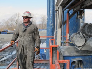 A worker stands by a natural gas well in Susquehanna County, Pa.