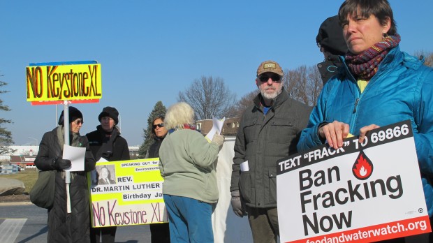 About 50 climate change protesters gathered outside a meeting of national Republican leaders today in Hershey.