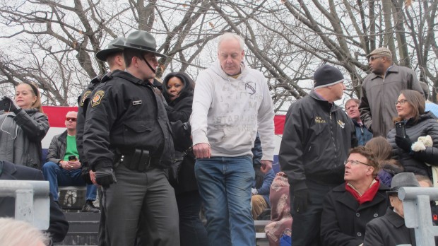 An anti-fracking protester was led away by police after he shouted at Governor Wolf during his inauguration speech.