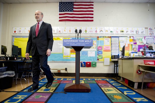 Gov. Wolf steps away from the podium at the end of a news conference at Caln Elementary School Wednesday, Feb. 11, 2015, in Thorndale, Pa.  Wolf kicked off a statewide "Schools that Teach Tour" and outlined a forthcoming proposal to the Legislature to increase taxes on Pennsylvania's natural gas industry to help boost aid to public schools. 
