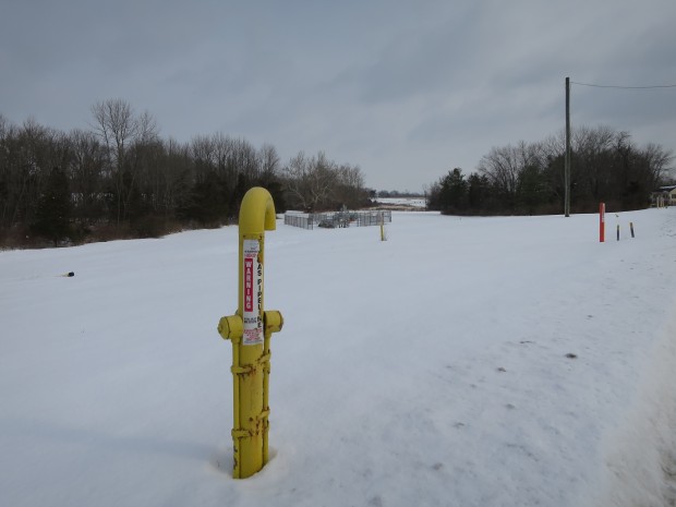 A marker shows the path of the Texas Eastern Pipeline as it a field in Lambertville, New Jersey. It is one of several natural gas pipelines buried under farms, forests, backyards and waterways in the region.