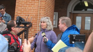 Activist Vera Scroggins speaks with reporters after an October 2014 court hearing.