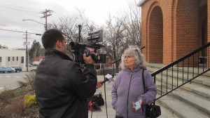 Fracking activist Vera Scroggins speaks with a reporter outside the courthouse in Montrose after her most recent hearing in April.