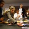 Ida Lieszkovszky of StateImpact Ohio arranges a sample photo story while Sarah Gonzalez (FL, far left), John O'Connor (FL), Dave Fehling (TX) and Molly Bloom (OH) look on.