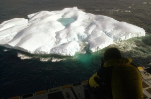 A photographer captures an image of an iceberg from the cargo ramp of a Coast Guard Hercules C-130 Aircraft April 21, 2003 in the north Atlantic Ocean.