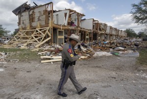 Texas Department of Public Safety Sergeant Jason Reyes walks past the site of an apartment complex destroyed by the deadly fertilizer plant explosion in West. 