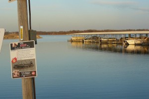 A sign in Smithville, Missouri warns boaters about zebra mussels.