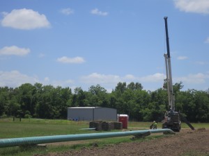 Crews bury the Crosstex NGL pipeline in a farm field in East TExas. The pipeline has been the cause of ongoing litigation.