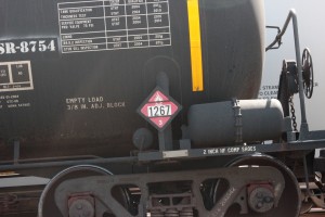 In a rail yard in Houston, a tank car for crude oil as identified by "1267" placard