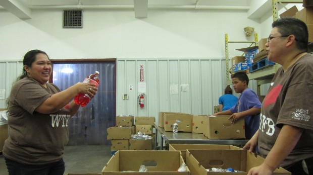 Staff and volunteers prepare food boxes at the West Texas Food Bank in Odessa.  "Food insecurity" in the Permian Basin dropped from 2011 to 2012. 